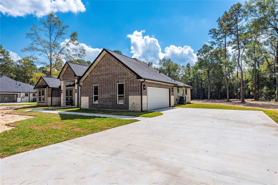 Front exterior of a new home in , Dayton, TX, highlighting curb appeal (Image 1). Front exterior of a new home in , Dayton, TX, highlighting curb appeal (Image 1).