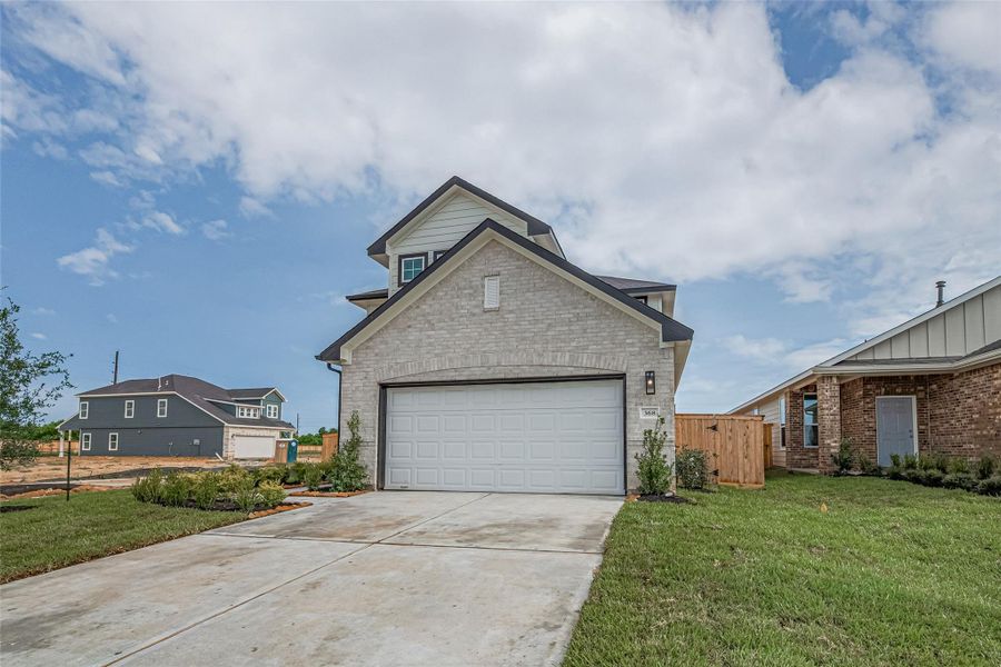 Front exterior of a new home in La Segarra, Brookshire, TX, highlighting curb appeal (Image 27).