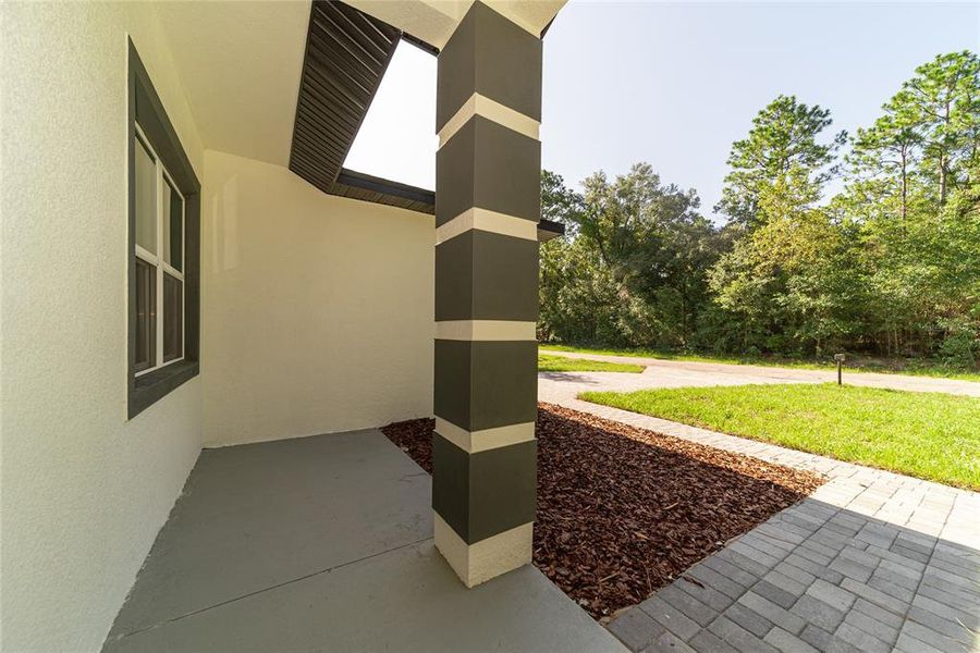 Exterior details and patio area of a home in , Citrus Springs (Image 30).
