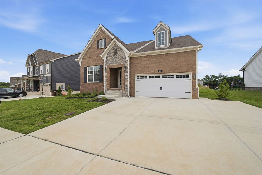 Front exterior of a new home in The Retreat at Norman Farm, Hendersonville, TN, highlighting curb appeal (Image 23).