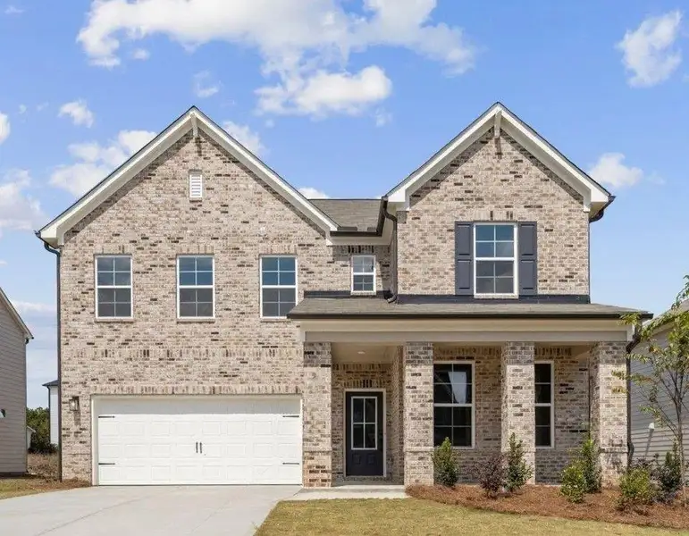 Front exterior of a new home in Oak Grove Glen, Snellville, GA, highlighting curb appeal (Image 1). Front exterior of a new home in Oak Grove Glen, Snellville, GA, highlighting curb appeal (Image 1).