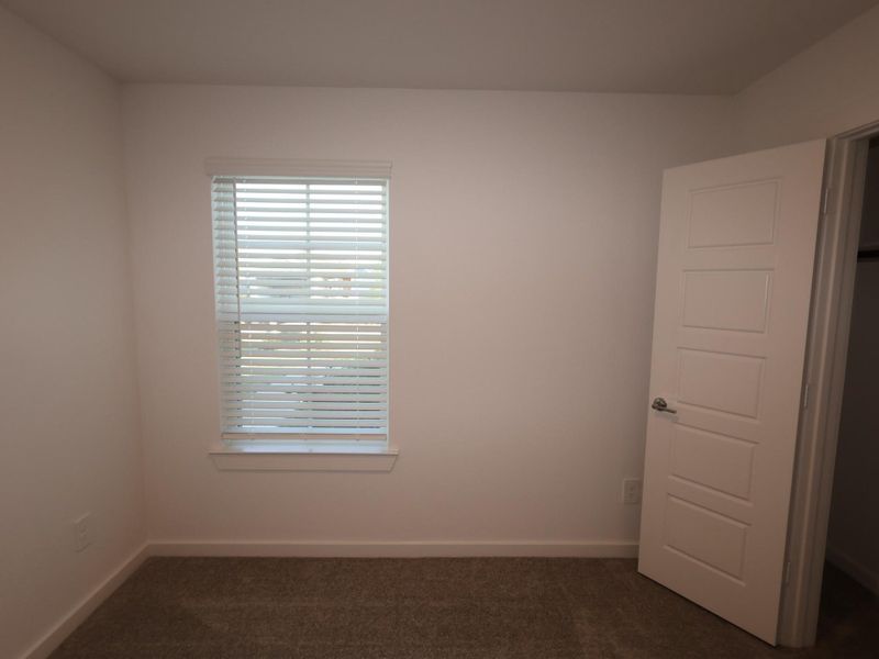 Spacious, unfurnished interior of a new home in Pinewood at Grand Texas, New Caney (Image 23).