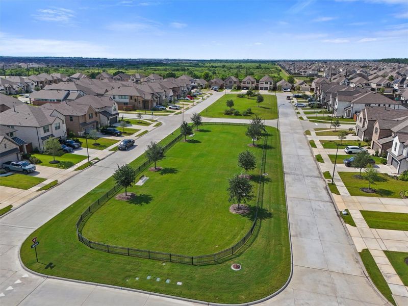 This photo highlights one of the dog parks within the Elyson community, emphasizing the neighborhood's focus on green space and a family-friendly design. It showcases the beautiful and well-maintained common areas that contribute to the exceptional lifestyle in the community.