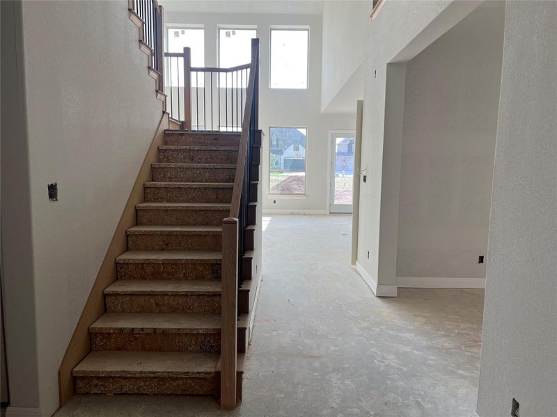 Staircase with baseboards and concrete floors Staircase with baseboards and concrete floors