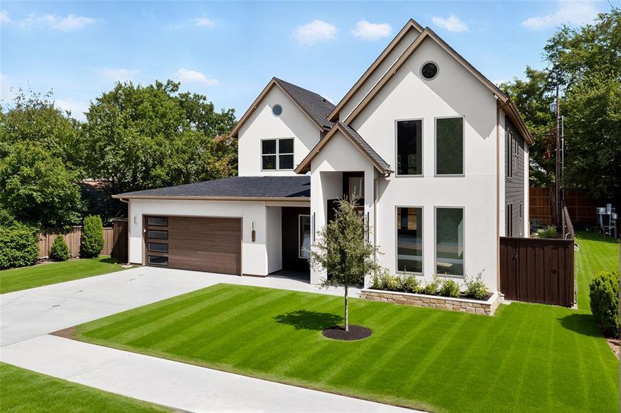 View of front of property featuring stucco siding, concrete driveway, a garage, and a shingled roof View of front of property featuring stucco siding, concrete driveway, a garage, and a shingled roof