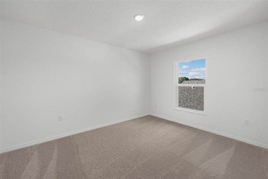 Spacious, unfurnished interior of a new home in Peach Crossings, Winter Haven (Image 30).