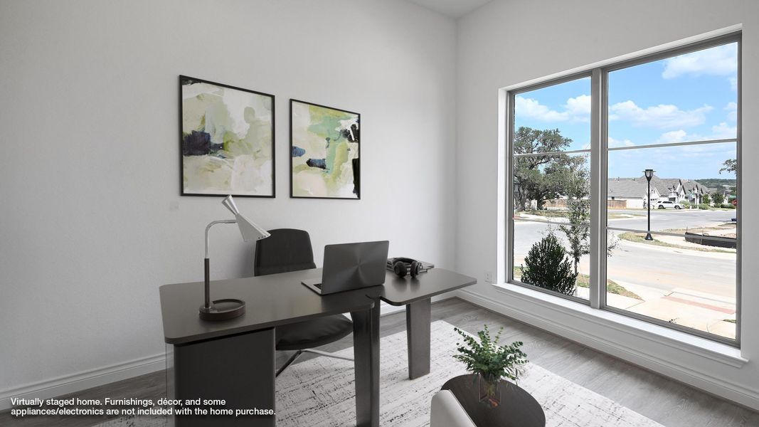 Office space featuring wood finished floors and baseboards Office space featuring wood finished floors and baseboards