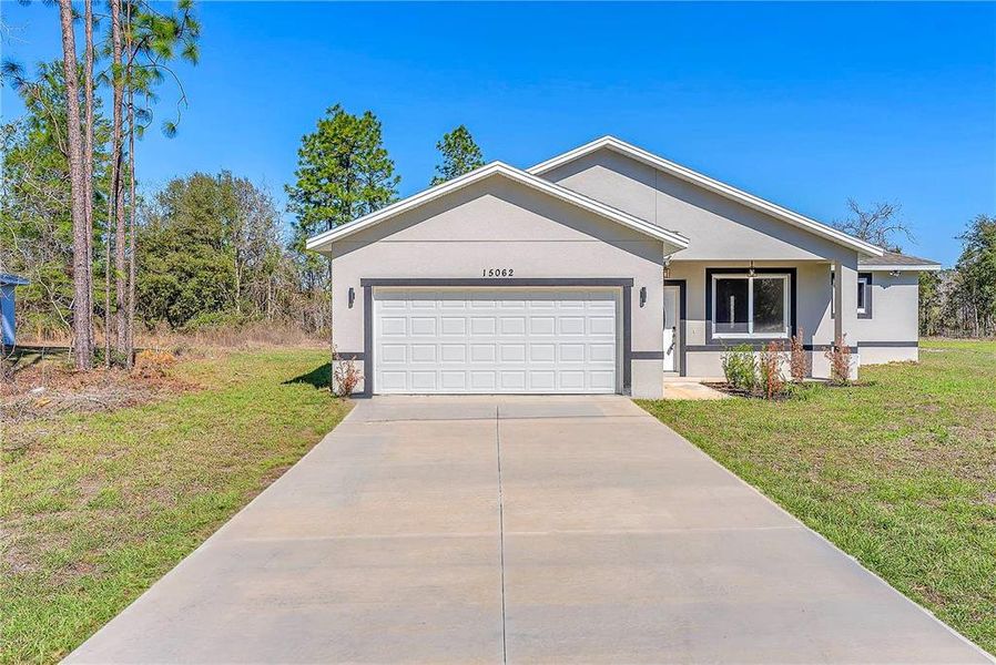 Front exterior of a new home in , Ocala, FL, highlighting curb appeal (Image 32).