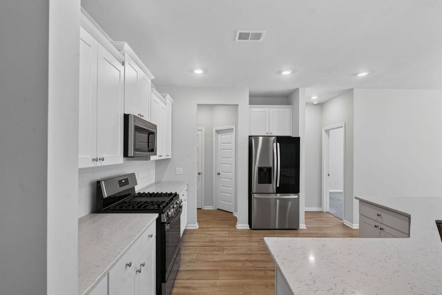 Furnished interior view inside a new home in Sweetgrass at Summers Corner, Summerville (Image 35).