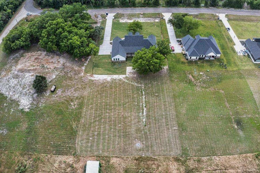 Expansive undeveloped land parcels featuring visible road access