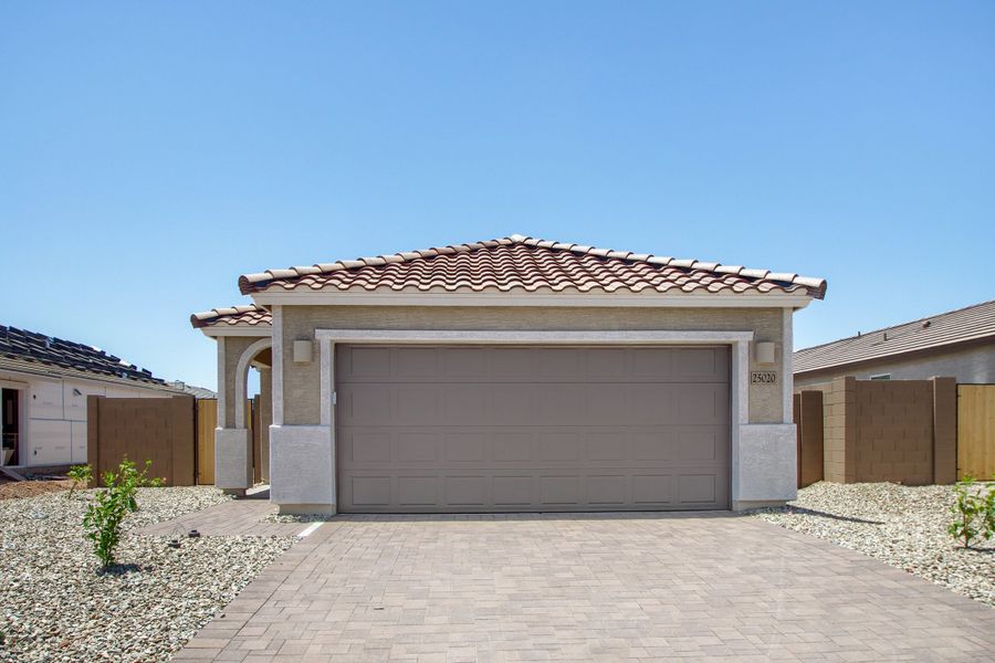 Front exterior of a new home in Asante Heritage | Active Adult, Surprise, AZ, highlighting curb appeal (Image 1). Front exterior of a new home in Asante Heritage | Active Adult, Surprise, AZ, highlighting curb appeal (Image 1).