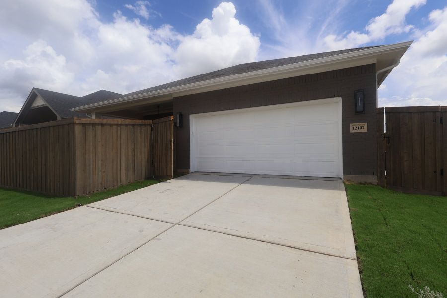 Exterior details and patio area of a home in Riceland - Enclave Row Collection, Mont Belvieu (Image 4).