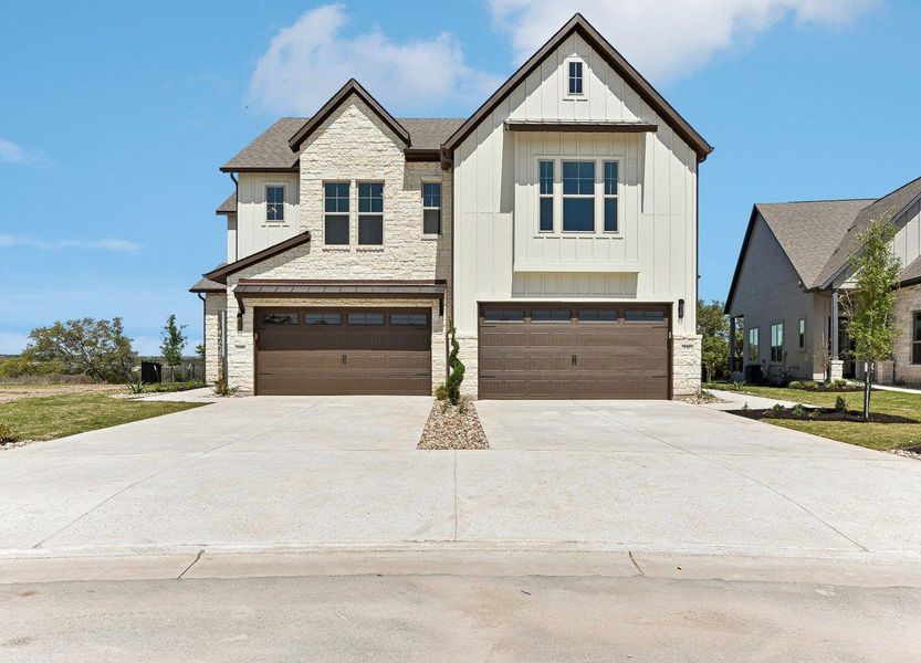 Front exterior of a new home in Santa Rita Ranch – Townhomes, Liberty Hill, TX, highlighting curb appeal (Image 12). Front exterior of a new home in Santa Rita Ranch – Townhomes, Liberty Hill, TX, highlighting curb appeal (Image 12).