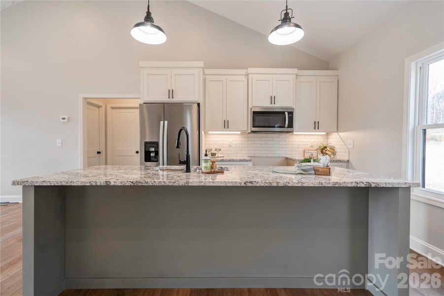 Kitchen has a breakfast bar. Kitchen has a breakfast bar.