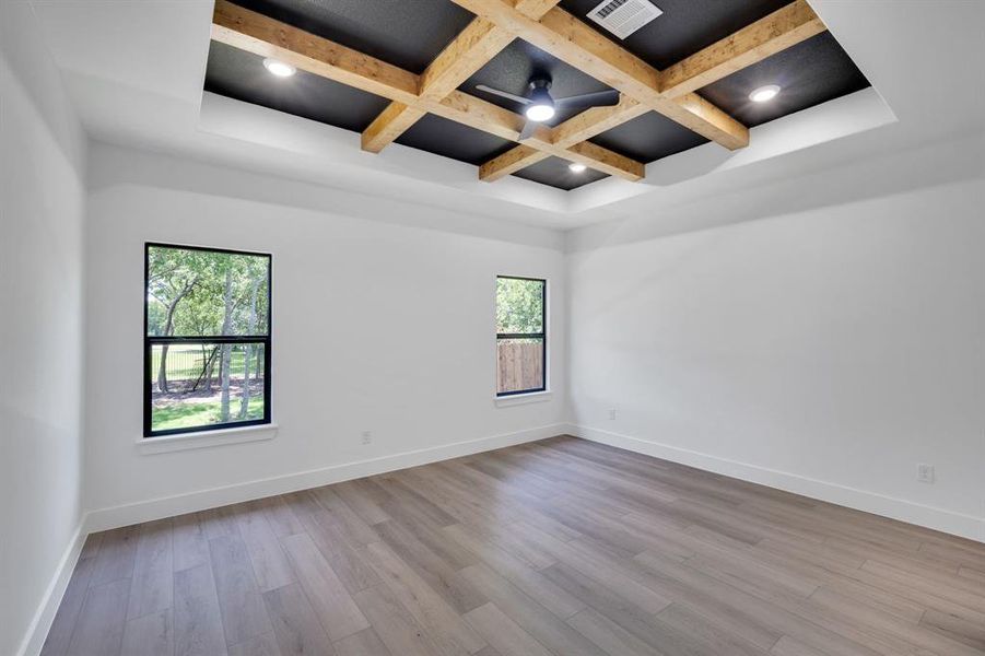 Impressive coffered ceiling with natural wood beams.