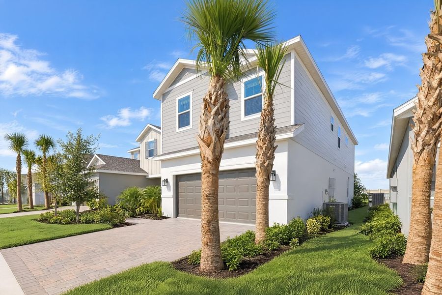 Front exterior of a new home in Lochside, Mount Dora, FL, highlighting curb appeal (Image 21).