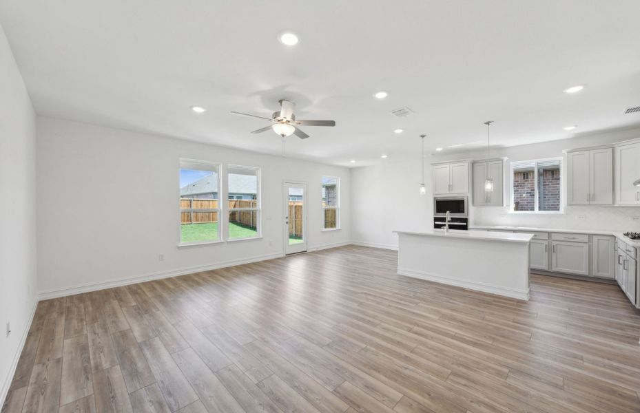 Airy kitchen with oversized island and ample cabinet space