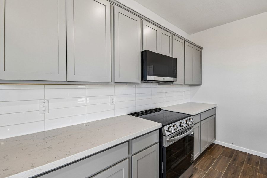 A kitchen with white cabinets. A kitchen with white cabinets.
