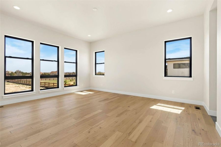 Spacious, unfurnished interior of a new home in Acadia at RainDance, Windsor (Image 21).