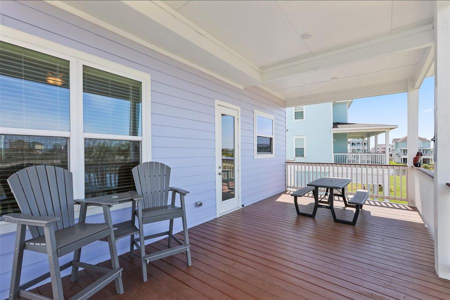 The second balcony, located off the kitchen, provides a seamless indoor-outdoor flow and is the perfect spot for dining al fresco or unwinding with evening cocktails.