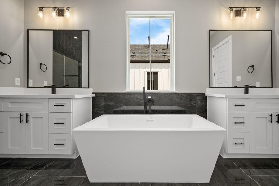 Spa like bathroom with his and her area sinks
