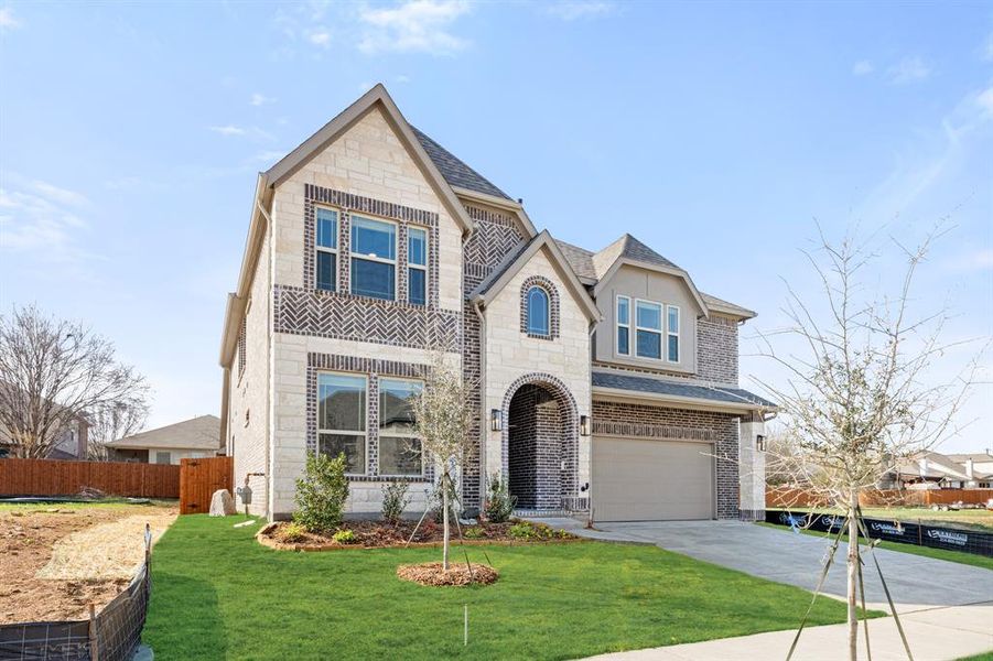 Front exterior of a new home in Glenwood Meadows, Argyle, TX, highlighting curb appeal (Image 1). Front exterior of a new home in Glenwood Meadows, Argyle, TX, highlighting curb appeal (Image 1).