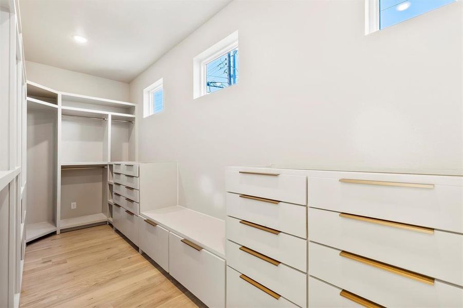 Spacious closet featuring light wood-type flooring