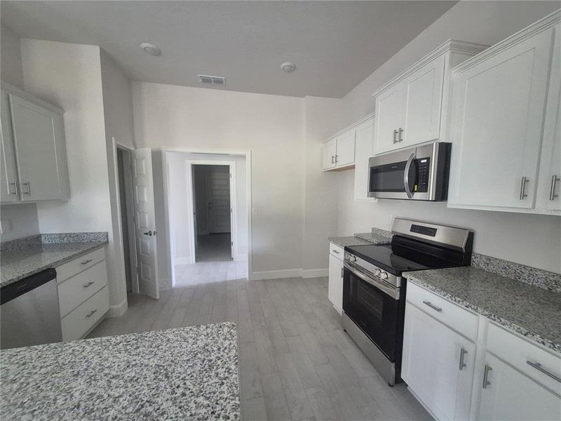 Furnished interior view inside a new home in Hill Country Estates, Dade City (Image 13).