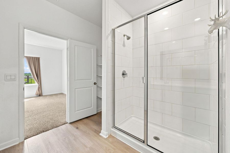 Clean lines and classic subway tile define this modern walk-in shower enclosure.