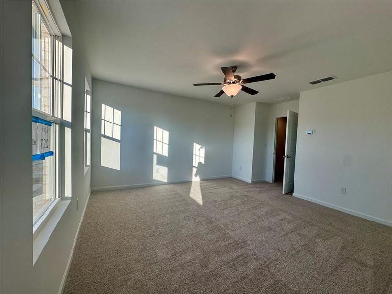 Spacious, unfurnished interior of a new home in Eastlyn Crossing, Flowery Branch (Image 13).