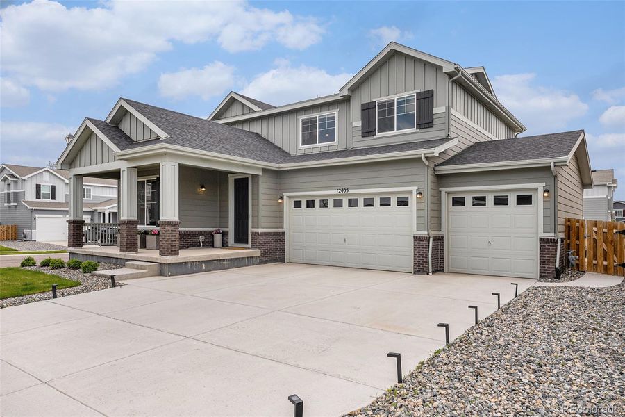 Front exterior of a new home in , Commerce City, CO, highlighting curb appeal (Image 23).