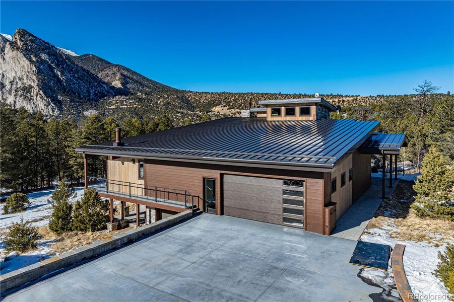 Paved driveway to main level 2-car and lower-level 1-car garages Paved driveway to main level 2-car and lower-level 1-car garages