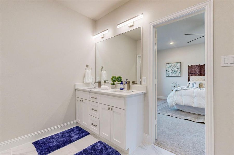 Main Bathroom featuring tile flooring, ceiling fan, and double sink vanity