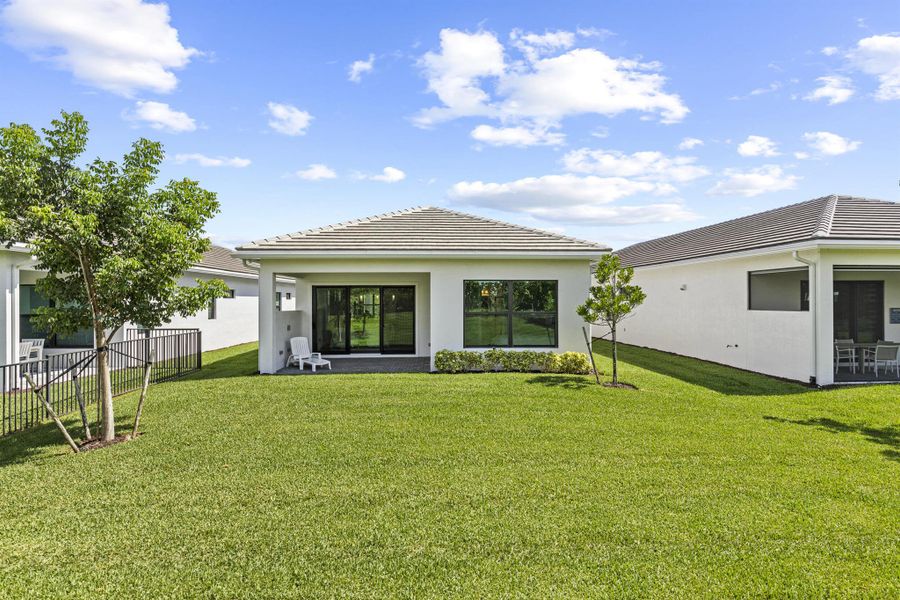 Front exterior of a new home in , The Acreage, FL, highlighting curb appeal (Image 23).