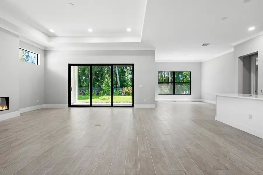 Great Room and Dining to Backyard
