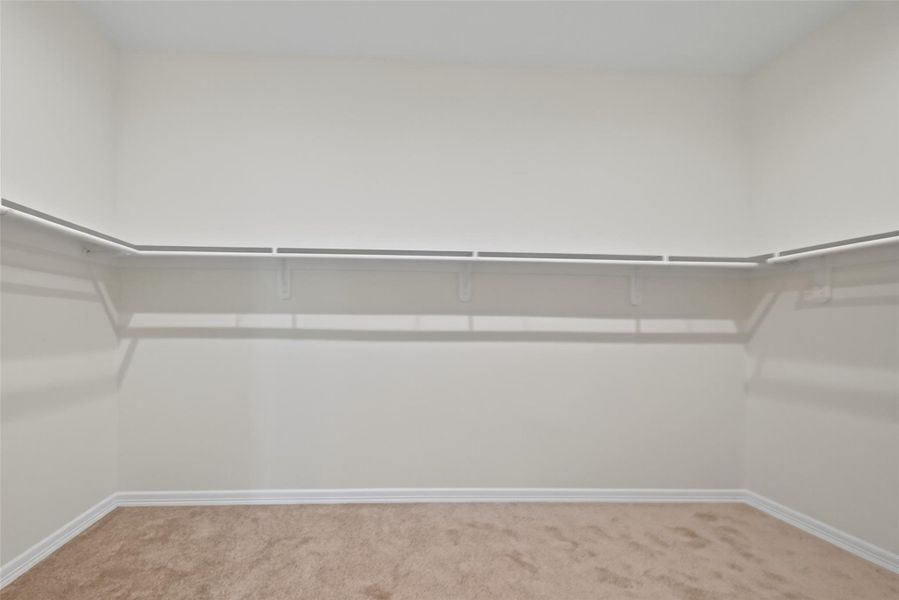 Oversized primary bedroom closet.