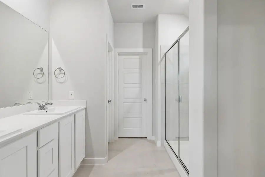Primary Bathroom in the Oscar home plan by Trophy Signature Homes – REPRESENTATIVE PHOTO Primary Bathroom in the Oscar home plan by Trophy Signature Homes – REPRESENTATIVE PHOTO