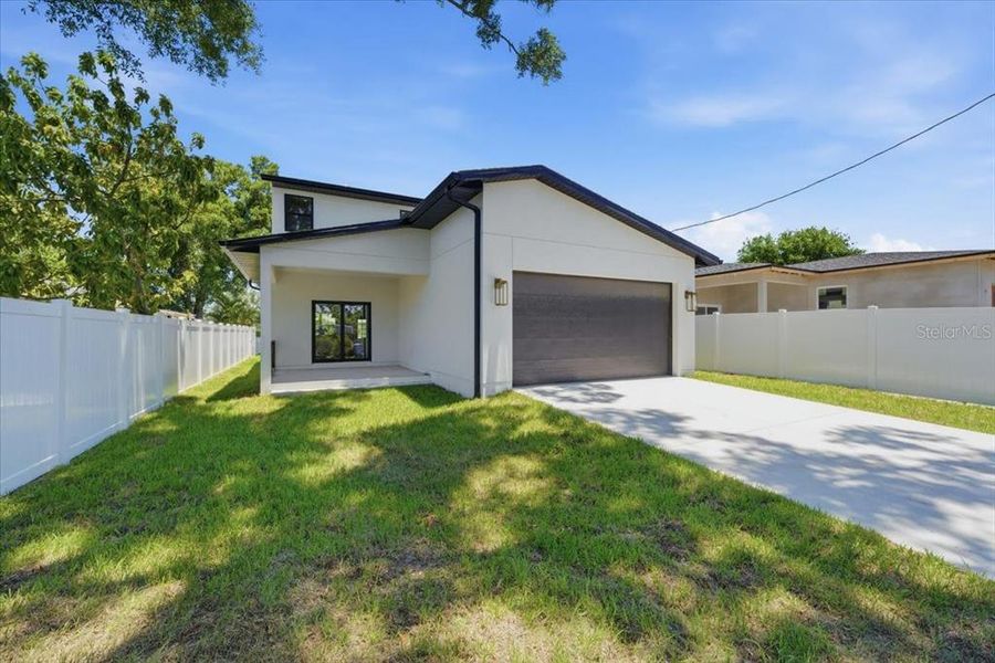 Front exterior of a new home in , St. Petersburg, FL, highlighting curb appeal (Image 2). Front exterior of a new home in , St. Petersburg, FL, highlighting curb appeal (Image 2).