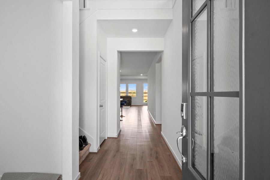 The entry hall gives a longer look into the home’s first-floor layout, with light flooring and a direct path toward the main living spaces. The glass-panel detail adds a polished transition into the interior. The entry hall gives a longer look into the home’s first-floor layout, with light flooring and a direct path toward the main living spaces. The glass-panel detail adds a polished transition into the interior.