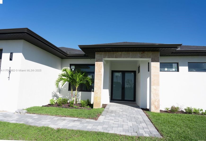 Front exterior of a new home in , Cape Coral, FL, highlighting curb appeal (Image 19).