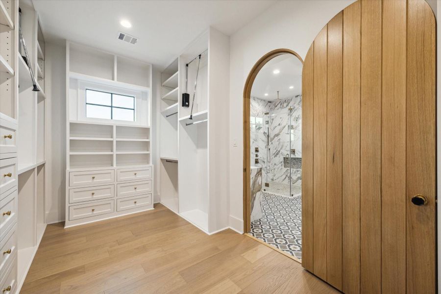 Primary closet with abundant built-ins, storage*Picture is of a recently constructed home by the builder.  1519 Candlelight will be similar in quality, but these pictures are not meant to be an exact representation of the new home. Specs of home may change at sole discretion of the seller.