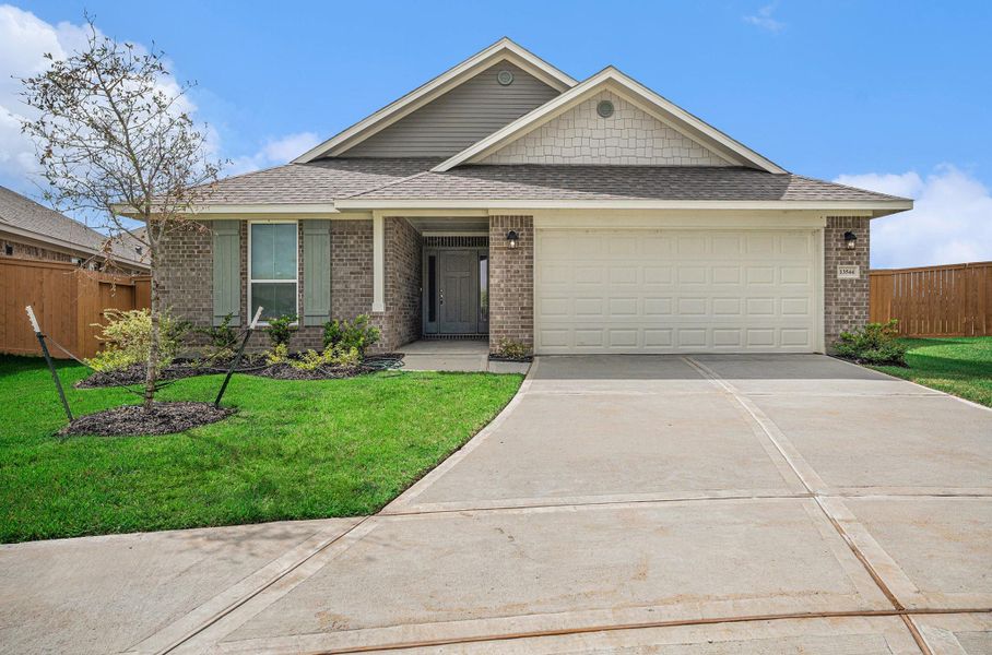 Front exterior of a new home in Lago Mar, Texas City, TX, highlighting curb appeal (Image 1). Front exterior of a new home in Lago Mar, Texas City, TX, highlighting curb appeal (Image 1).