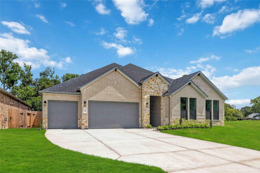 Front exterior of a new home in Friendswood Trails 70' Homesites, Friendswood, TX, highlighting curb appeal (Image 19).