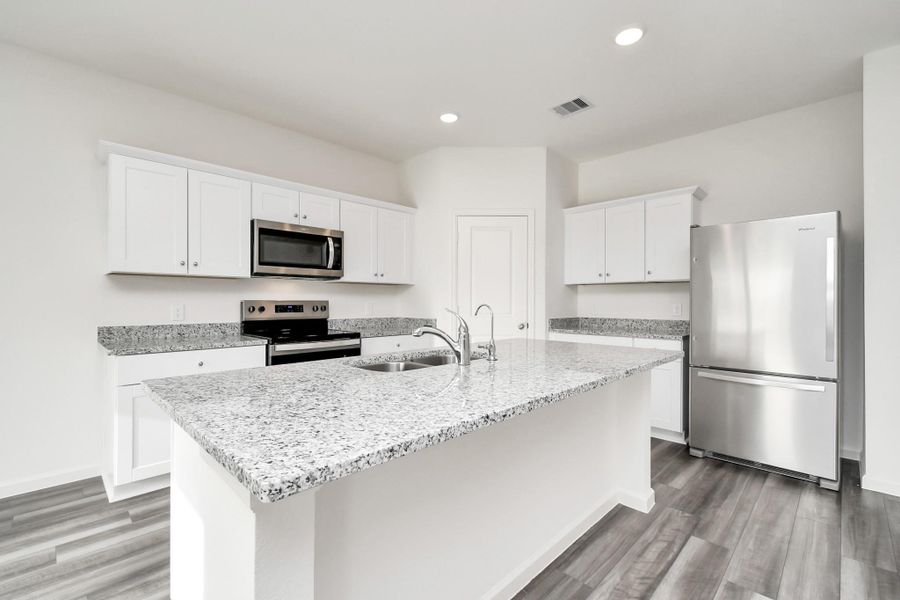 Furnished interior view inside a new home in Sunterra, Katy (Image 8).