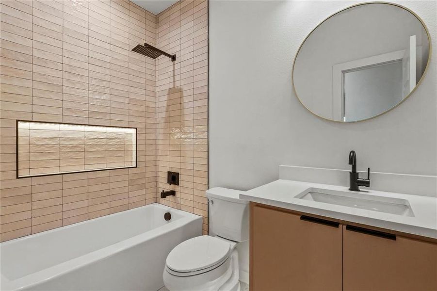 Bathroom featuring vanity and washtub / shower combination Bathroom featuring vanity and washtub / shower combination