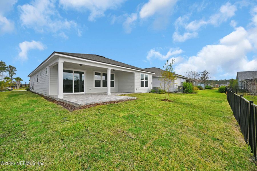 Exterior details and patio area of a home in Summer Bay at Grand Oaks, St. Augustine (Image 24).