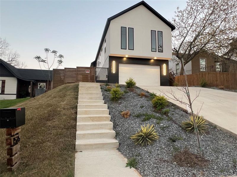 Front exterior of a new home in , Dallas, TX, highlighting curb appeal (Image 16).