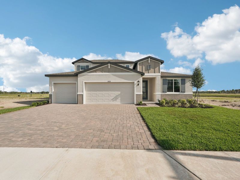 Front exterior of a new home in Oakfield Trails - Signature Series, Parrish, FL, highlighting curb appeal (Image 2). Front exterior of a new home in Oakfield Trails - Signature Series, Parrish, FL, highlighting curb appeal (Image 2).