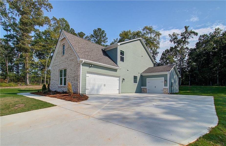 Front exterior of a new home in , Senoia, GA, highlighting curb appeal (Image 1). Front exterior of a new home in , Senoia, GA, highlighting curb appeal (Image 1).