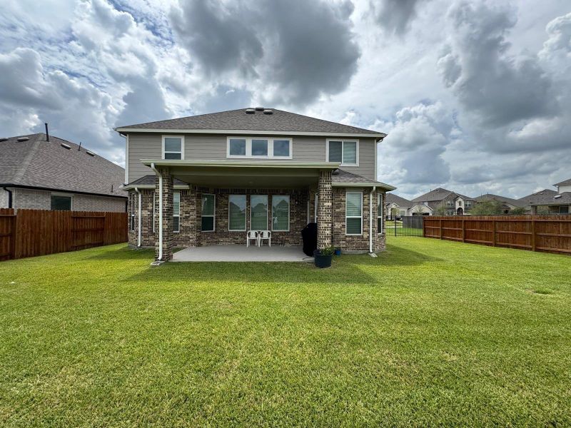 Front exterior of a new home in Rodeo Palms - The Lakes, Manvel, TX, highlighting curb appeal (Image 23). Front exterior of a new home in Rodeo Palms - The Lakes, Manvel, TX, highlighting curb appeal (Image 23).